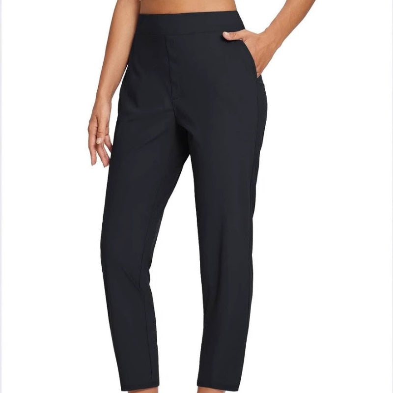 Hoge elastische broek voor dames met zakken met ritssluiting