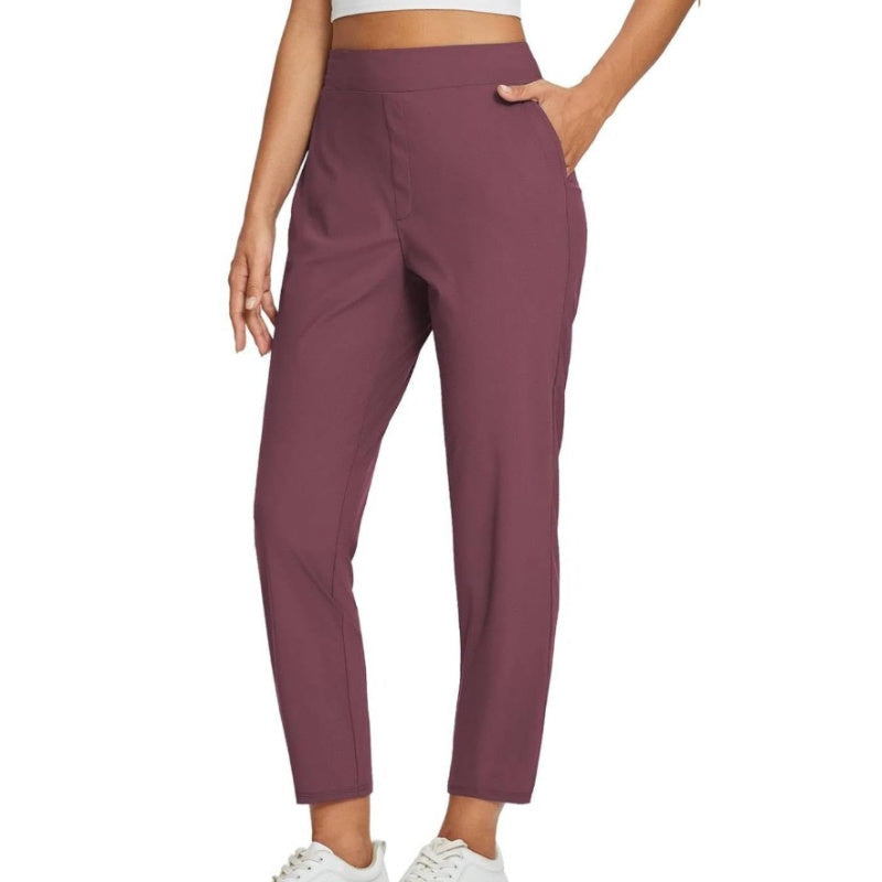 Hoge elastische broek voor dames met zakken met ritssluiting