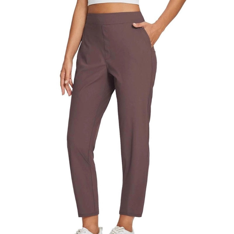 Hoge elastische broek voor dames met zakken met ritssluiting
