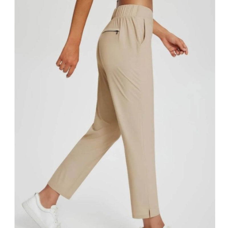 Hoge elastische broek voor dames met zakken met ritssluiting