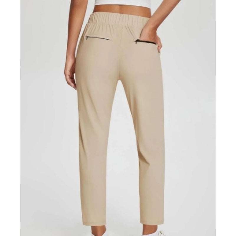 Hoge elastische broek voor dames met zakken met ritssluiting