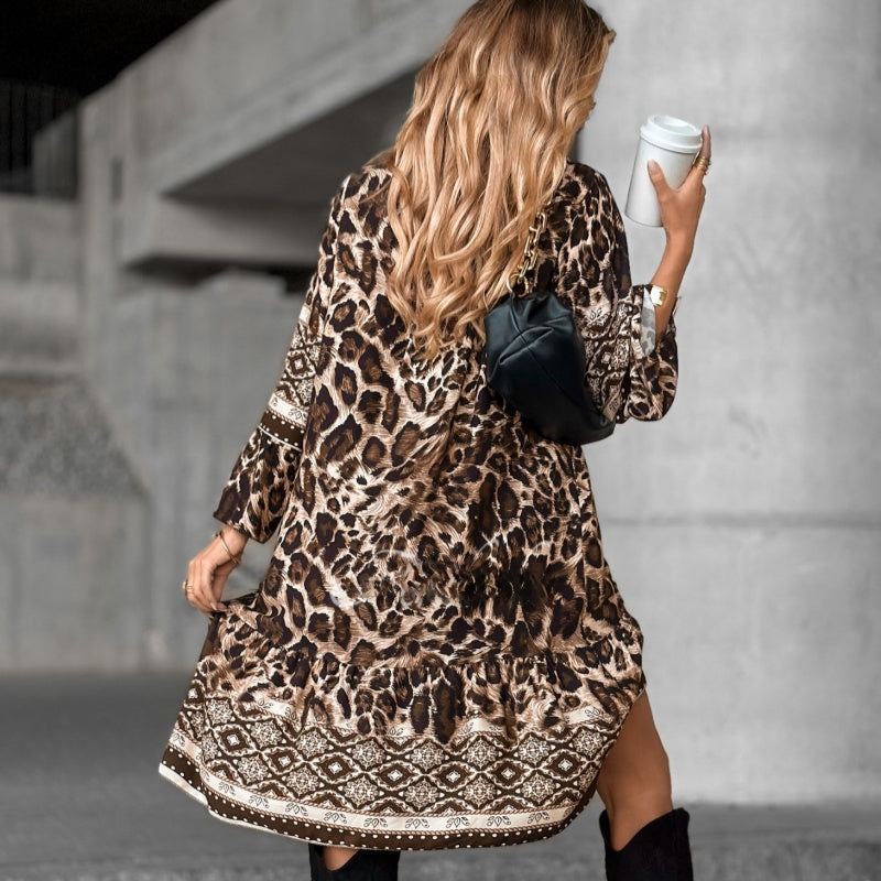 Elegante jurk met V-hals, lange mouwen en print