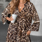 Elegante jurk met V-hals, lange mouwen en print