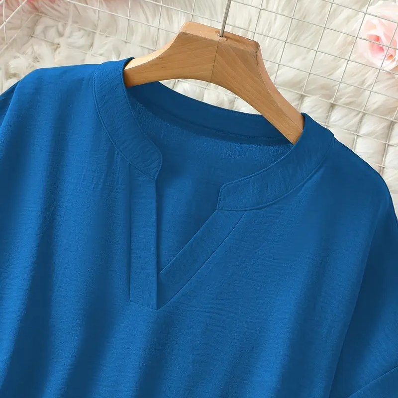 Modieuze losse top met korte mouwen in effen kleur