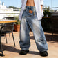 Dames jeans met asymmetrische taille en wijde pijpen